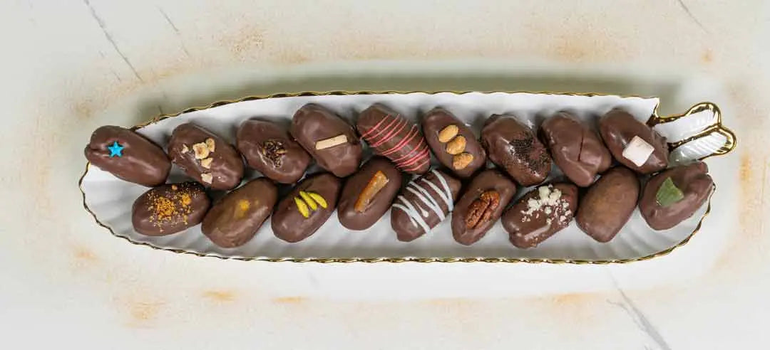 Oval Tawfi tray with assorted chocolate dates